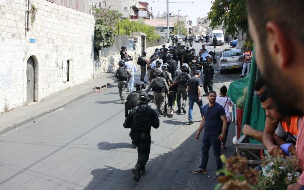Israeli security forces arrest a Palestinian rioter in Wadi Joz, near the Old City of Jerusalem, July 21, 2017. (Judah Ari Gross/Times of Israel) Israeli security forces arrest a Palestinian rioter in Wadi Joz, near the Old City of Jerusalem, July 21, 2017. (Judah Ari Gross/Times of Israel)