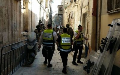 ZAKA volunteers next to the entrance to the Temple Mount in Jerusalem following the July 14, 2017, terror attack. (courtesy ZAKA)