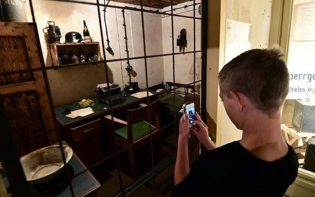 A tourist takes a picture of the Nazi bunkers built during World War II in the Netherlands. (Emmanuel Durrand/AFP) A tourist takes a picture of the Nazi bunkers built during World War II in the Netherlands. (Emmanuel Durrand/AFP)