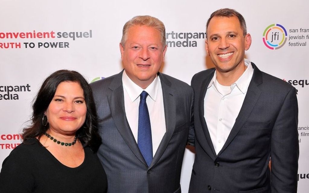 Al Gore, center, with filmmaking couple Bonni Cohen and Jon Shenk at the San Francisco Jewish Film Festival on July 24, 2017. The duo produced a documentary follow up 'An Inconvenient Sequel,' to Gore's Oscar-winning first film on climate change. (Courtesy SJFF) Al Gore, center, with filmmaking couple Bonni Cohen and Jon Shenk at the San Francisco Jewish Film Festival on July 24, 2017. The duo produced a documentary follow up 'An Inconvenient Sequel,' to Gore's Oscar-winning first film on climate change. (Courtesy SJFF)