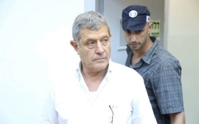 Miki Ganor, arrested in the submarine affair also known as 'Case 3000,' is brought for a court hearing at the Magistrate's Court in Rishon Lezion, July 10, 2017. (Moti Kimchi/Pool)