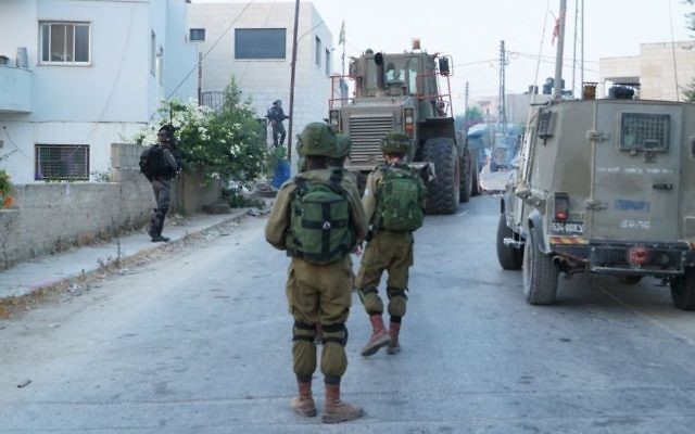 IDF forces operate in the West Bank settlement of Halamish on July 23, 2017. (IDF spokesman)