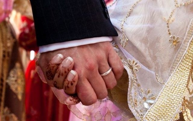 Illustrative photo of a bride and groom holding hands at a Muslim wedding in Morocco. iStock photo/Getty images) Illustrative photo of a bride and groom holding hands at a Muslim wedding in Morocco. iStock photo/Getty images)