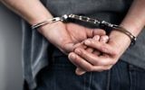 Illustrative image of a person being arrested. (BrianAJackson via iStock by Getty images)