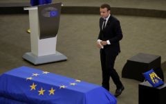 French President Emmanuel Macron walks past Helmut Kohl's coffin during a eulogy ceremony for former German Chancellor Helmut Kohl, at the European Parliament in Strasbourg, eastern France, July 1, 2017.  (AP Photo/Michel Euler)