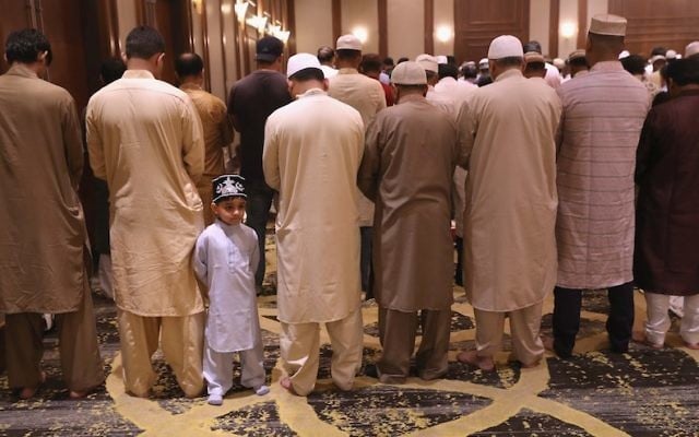 Muslims at a prayer service celebrating Eid-al-Fitr in Stamford, Conn., June 25, 2017. (John Moore/Getty Images, via JTA) Muslims at a prayer service celebrating Eid-al-Fitr in Stamford, Conn., June 25, 2017. (John Moore/Getty Images, via JTA)