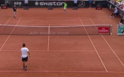 A neo-Nazi protester (top left) interrupts a tennis match in the Swedish Open on Saturday, July 22, 2017 (screen capture: Expressen.se)