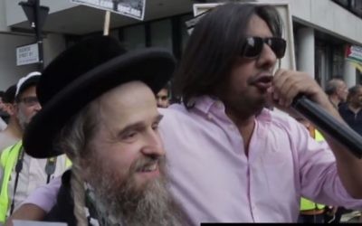 Nazim Ali (r), of Islamic Human Rights Commission (IHRC), chants anti-Zionist rhetoric at London's Al-Quds Parade on June 18. 2017. (Screen capture: YouTube)
