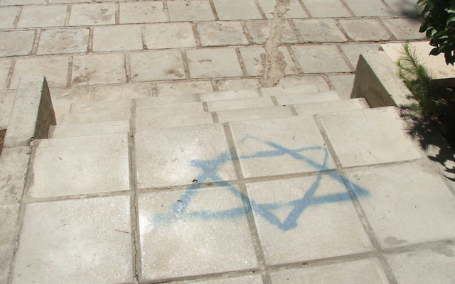 The Star of David outside the University of Jordan’s law department in 2006 was there so visitors could step all over the Jewish and Israeli symbol on their way to class. (Uriel Heilman)
