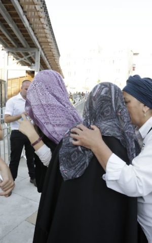 Masked women interrupt the Women of the Wall prayer event at the Western Wall, on July 24, 2017. (Hila Shiloni) Masked women interrupt the Women of the Wall prayer event at the Western Wall, on July 24, 2017. (Hila Shiloni)