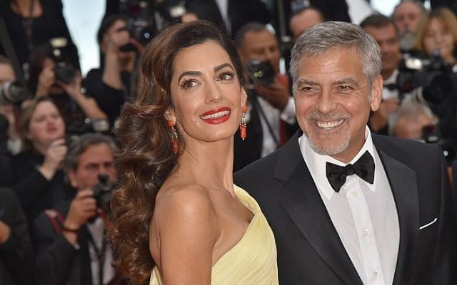 US actor George Clooney (R) and his wife Amal Clooney at the 69th Cannes Film Festival in Cannes, southern France, May 16, 2016. (LOIC VENANCE / AFP) US actor George Clooney (R) and his wife Amal Clooney at the 69th Cannes Film Festival in Cannes, southern France, May 16, 2016. (LOIC VENANCE / AFP)