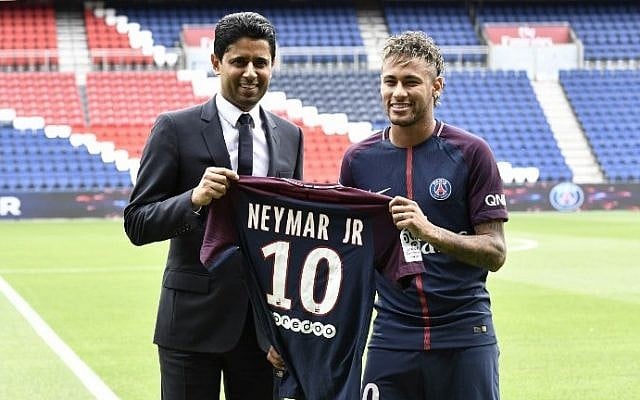 Brazilian superstar Neymar (R) poses with his jersey next to Paris Saint Germain's (PSG) Qatari president Nasser Al-Khelaifi during his official presentation at Paris' Parc des Princes stadium on August 4, 2017.
(AFP Photo/Philippe Lopez) Brazilian superstar Neymar (R) poses with his jersey next to Paris Saint Germain's (PSG) Qatari president Nasser Al-Khelaifi during his official presentation at Paris' Parc des Princes stadium on August 4, 2017.
(AFP Photo/Philippe Lopez)