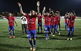 Players from Gaza's Shabab Rafah soccer team celebrate following their victory in the second leg of the Palestinian Cup final at the stadium in the city of Dura, near the West Bank town of Hebron, on August 4, 2017. (AFP Photo/Hazem Bader)