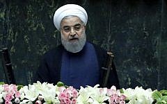 Iran's President Hassan Rouhani delivers a speech after being sworn in before parliament in Tehran, on August 5, 2017. (AFP Photo/Atta Kenare)