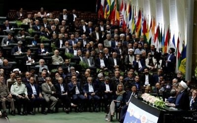 Iran's President Hassan Rouhani (2-R) delivers a speech after being sworn in before parliament in Tehran, on August 5, 2017. (AFP PHOTO / ATTA KENARE)