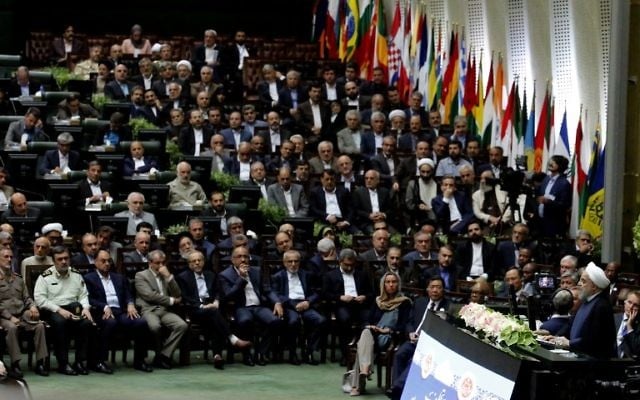 Iran's President Hassan Rouhani (2-R) delivers a speech after being sworn in before parliament in Tehran, on August 5, 2017. (AFP PHOTO / ATTA KENARE) Iran's President Hassan Rouhani (2-R) delivers a speech after being sworn in before parliament in Tehran, on August 5, 2017. (AFP PHOTO / ATTA KENARE)