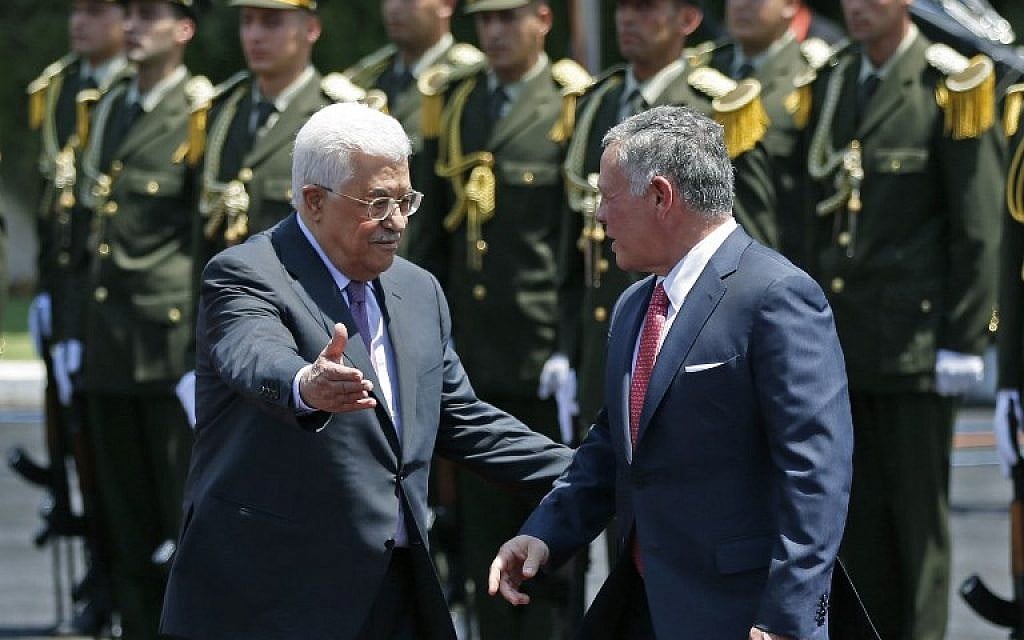 Jordan's King Abdullah II (right) speaks with Palestinian Authority President Mahmoud Abbas upon his arrival in the West Bank city of Ramallah on August 7, 2017. (AFP PHOTO / ABBAS MOMANI) Jordan's King Abdullah II (right) speaks with Palestinian Authority President Mahmoud Abbas upon his arrival in the West Bank city of Ramallah on August 7, 2017. (AFP PHOTO / ABBAS MOMANI)