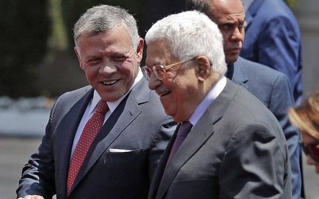 Jordan's King Abdullah II, left, speaks with Palestinian Authority President Mahmuod Abbas upon his arrival in the West Bank city of Ramallah, August 7, 2017. (AFP/Ahmad GHARABLI) Jordan's King Abdullah II, left, speaks with Palestinian Authority President Mahmuod Abbas upon his arrival in the West Bank city of Ramallah, August 7, 2017. (AFP/Ahmad GHARABLI)