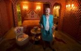 This file photo taken on May 31, 2013 in Paris shows Helene Martini, nicknamed the 'Empress of the night,' who overlooked 17 cabarets and directed the 'Folies Bergeres' cabaret for 37 years, posing for a photograph in her room decorated by Franco-Russian artist Romain de Tirtoff, also known as 'Erte'. (AFP / JOEL SAGET)