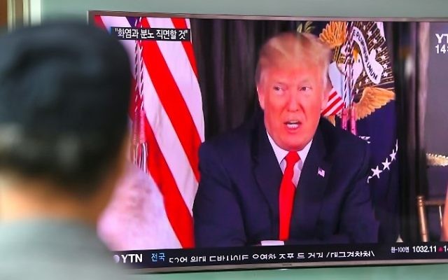 A man watches a television news program showing US President Donald Trump at a railway station in Seoul on August 9, 2017. (AFP/Jung Yeon-Je) A man watches a television news program showing US President Donald Trump at a railway station in Seoul on August 9, 2017. (AFP/Jung Yeon-Je)