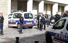 Police gather at the scene of a suspected car-ramming attack on French soldiers on patrol in the Paris suburb of Levallois-Perret on August 9, 2017. (AFP Photo/Stephane De Sakutin)
