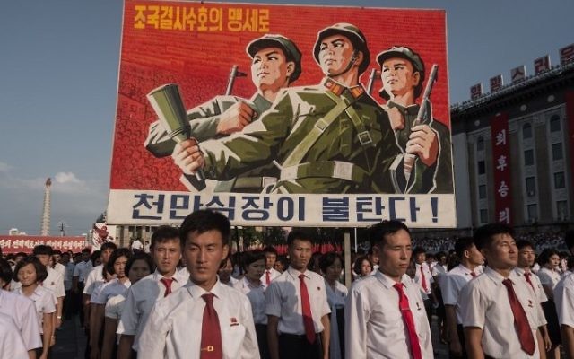 A propaganda poster is displayed during a rally in support of North Korea's stance against the US, on Kim Il-Sung square in Pyongyang on August 9, 2017.
(AFP /KIM Won-Jin) A propaganda poster is displayed during a rally in support of North Korea's stance against the US, on Kim Il-Sung square in Pyongyang on August 9, 2017.
(AFP /KIM Won-Jin)