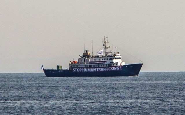 This file photo taken on August 05, 2017 shows a banner that reads, 'Stop Human Trafficking' attached to the side of the C-Star vessel as it sails in the Mediterranean Sea, 20 nautical miles off the Libyan coast. (AFP PHOTO / Angelos Tzortzinis) This file photo taken on August 05, 2017 shows a banner that reads, 'Stop Human Trafficking' attached to the side of the C-Star vessel as it sails in the Mediterranean Sea, 20 nautical miles off the Libyan coast. (AFP PHOTO / Angelos Tzortzinis)