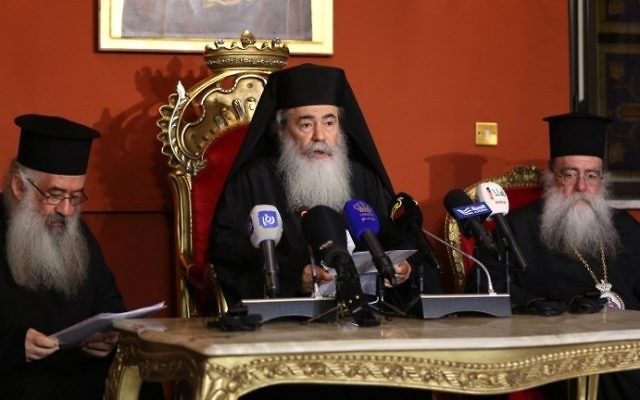 Greek Orthodox Patriarch of Jerusalem Theophilos III (C) speaks during a press conference in the Jordanian capital Amman on August 12, 2017. (AFP Photo/Khalil Mazraawi) Greek Orthodox Patriarch of Jerusalem Theophilos III (C) speaks during a press conference in the Jordanian capital Amman on August 12, 2017. (AFP Photo/Khalil Mazraawi)