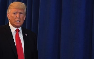 US President Donald Trump, on August 12, 2017, at Trump National Golf Club in Bedminster, New Jersey. / AFP PHOTO / JIM WATSON)