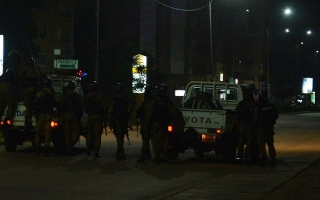 Burkina Faso gendarmes and army forces patrol the streets on August 13, 2017, as soldiers launch an operation against suspected jihadists in Burkina Faso after gunmen attacked a cafe in the capital Ouagadougou. (AFP Photo/Ahmed Ouoba) Burkina Faso gendarmes and army forces patrol the streets on August 13, 2017, as soldiers launch an operation against suspected jihadists in Burkina Faso after gunmen attacked a cafe in the capital Ouagadougou. (AFP Photo/Ahmed Ouoba)
