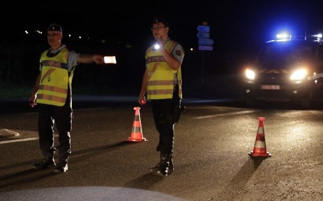 Police officers direct traffic on a road near the site where man smashed a car into a pizza restaurant in Sept-Sorts, 55km east of Paris, on August 14, 2017, killing a 13-year-old girl and seriously injuring four. (AFP/ Thomas Samson) Police officers direct traffic on a road near the site where man smashed a car into a pizza restaurant in Sept-Sorts, 55km east of Paris, on August 14, 2017, killing a 13-year-old girl and seriously injuring four. (AFP/ Thomas Samson)