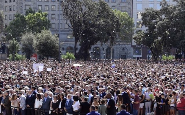 People wait before a minute of silence for the victims of the Barcelona attack at Plaza de Catalunya on August 18, 2017. (AFP/Javier Soriano) People wait before a minute of silence for the victims of the Barcelona attack at Plaza de Catalunya on August 18, 2017. (AFP/Javier Soriano)