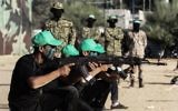 Young Palestinians take part in a military graduation ceremony at a Hamas summer camp in Khan Yunis, in the southern Gaza Strip, on August 18, 2017. (AFP PHOTO / SAID KHATIB)