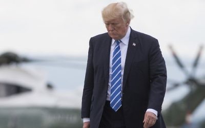 US President Donald Trump walks from Marine One to board Air Force One, prior to departing from Hagerstown Regional Airport in Hagerstown, Maryland, August 18, 2017. (AFP/SAUL LOEB)