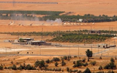 A general view taken on August 19, 2017, shows artillery being fired from a Lebanese military base in a mountainous area near the eastern town of Ras Baalbek, as Lebanese troops launched an offensive against the Islamic State group on the country's eastern border with Syria, seeking to drive the jihadists from a long-time stronghold. ( AFP PHOTO / STRINGER)