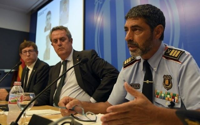 Josep Lluis Trapero (R), chief of the Catalan regional police, speaks alongside Interior Minister for the Catalan government Joaquim Forn (C) and Justice Minister of the Catalan government Carles Mundo at a press conference in Barcelona on August 21, 2017. (AFP Photo/Lluis Gene) Josep Lluis Trapero (R), chief of the Catalan regional police, speaks alongside Interior Minister for the Catalan government Joaquim Forn (C) and Justice Minister of the Catalan government Carles Mundo at a press conference in Barcelona on August 21, 2017. (AFP Photo/Lluis Gene)
