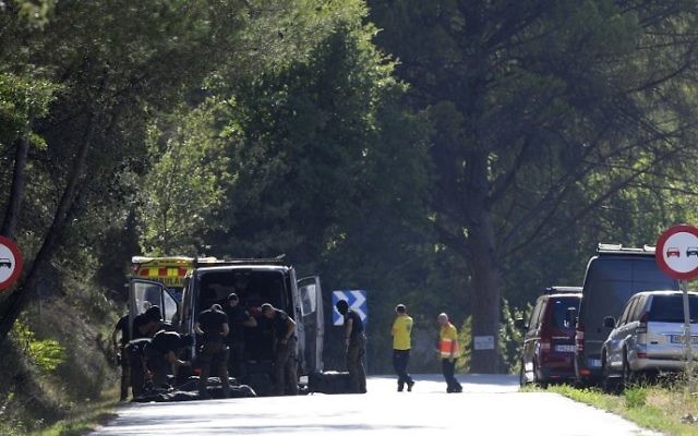 Members of the Spanish police bomb squad on the site where Moroccan suspect Younes Abouyaaqoub was shot on August 21, 2017 near Sant Sadurni d'Anoia, south of Barcelona, four days after the Barcelona and Cambrils attacks that killed 15 people. AFP/LLUIS GENE) Members of the Spanish police bomb squad on the site where Moroccan suspect Younes Abouyaaqoub was shot on August 21, 2017 near Sant Sadurni d'Anoia, south of Barcelona, four days after the Barcelona and Cambrils attacks that killed 15 people. AFP/LLUIS GENE)