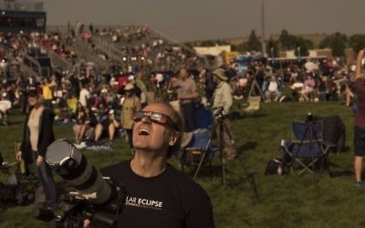Steve Kaltenhauser of Calgary, Canada, watches with the crowd during a total solar eclipse from the Lowell Observatory Solar Eclipse Experience on August 21, 2017 in Madras, Oregon. (Stan Honda/AFP)