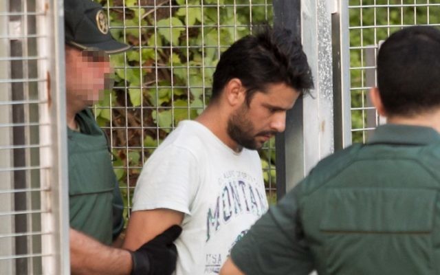 Mohamed Aallaa, suspected of involvement in the terror cell that carried out twin attacks in Spain, is escorded by Spanish Civil Guards from a detention center in Tres Cantos, near Madrid, on August 22, 2017 before being tranferred to the National Court.(AFP PHOTO / STRINGER) Mohamed Aallaa, suspected of involvement in the terror cell that carried out twin attacks in Spain, is escorded by Spanish Civil Guards from a detention center in Tres Cantos, near Madrid, on August 22, 2017 before being tranferred to the National Court.(AFP PHOTO / STRINGER)