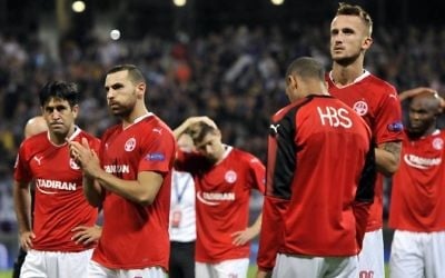 Hapoel Beer-Sheva players react at the end of the UEFA Champions League qualifying match against NK Maribor, August 22, 2017. (AFP Photo/Borut Zivulovic)