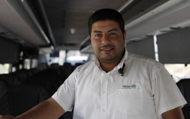 East Jerusalem Palestinian bus driver Ramadan Jamjoum poses on August 24, 2017 after he returned $10,000 to a Jewish man who left it in his vehicle. The passenger had forgotten the cash in Bnei Brak, a city near Tel Aviv dominated by ultra-Orthodox Jews. (AFP PHOTO / AHMAD GHARABLI) East Jerusalem Palestinian bus driver Ramadan Jamjoum poses on August 24, 2017 after he returned $10,000 to a Jewish man who left it in his vehicle. The passenger had forgotten the cash in Bnei Brak, a city near Tel Aviv dominated by ultra-Orthodox Jews. (AFP PHOTO / AHMAD GHARABLI)