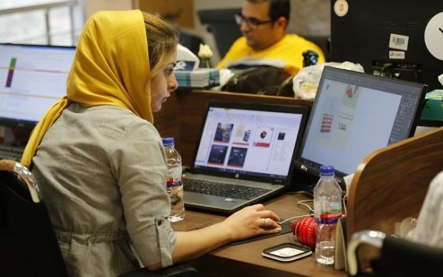 This file photo taken on July 9, 2017, shows Bamilo employees working at the e-commerce site's offices in the Iranian capital Tehran. (AFP Photo/Atta Kenare) This file photo taken on July 9, 2017, shows Bamilo employees working at the e-commerce site's offices in the Iranian capital Tehran. (AFP Photo/Atta Kenare)