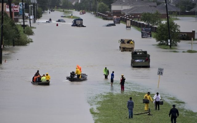 Volunteer rescuers evacuate people from a flooded residential area during the aftermath of Hurricane Harvey on August 29, 2017 in Houston, Texas. (AFP/Brendan Smialowski) Volunteer rescuers evacuate people from a flooded residential area during the aftermath of Hurricane Harvey on August 29, 2017 in Houston, Texas. (AFP/Brendan Smialowski)