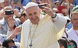 Pope Francis waves to the faithful as he arrives for his weekly general audience at St Peter's square on August 30, 2017 in Vatican.  (AFP PHOTO / ANDREAS SOLARO)