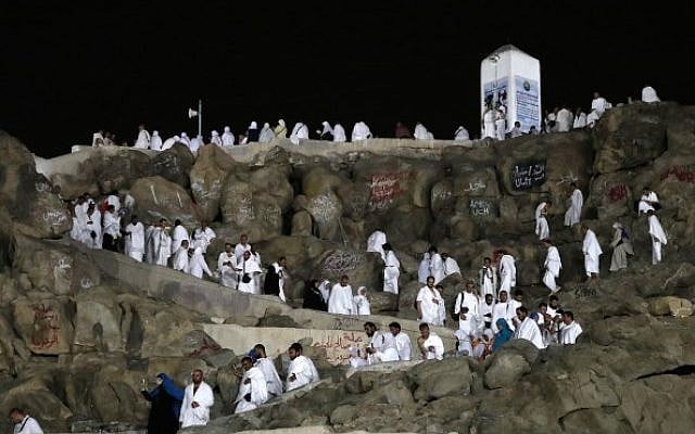 Muslim pilgrims walk and pray on Mount Arafat, also known as Jabal al-Rahma (Mount of Mercy), southeast of the Saudi holy city of Mecca, on the eve of Arafat Day which is the climax of the Hajj pilgrimage on August 30, 2017. (Karim Sahib/AFP) Muslim pilgrims walk and pray on Mount Arafat, also known as Jabal al-Rahma (Mount of Mercy), southeast of the Saudi holy city of Mecca, on the eve of Arafat Day which is the climax of the Hajj pilgrimage on August 30, 2017. (Karim Sahib/AFP)