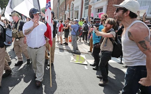 White nationalists, neo-Nazis and members of the "alt-right" are confronted by protesters as they march down East Market Street toward Lee Park during the "Unite the Right" rally August 12, 2017 in Charlottesville, Virginia. (Chip Somodevilla/Getty Images/AFP)