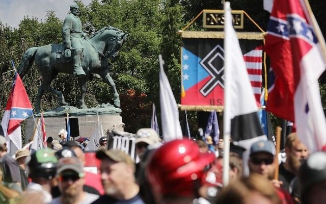 A statue of Confederate General Robert E. Lee stands behind a crowd of hundreds of white nationalists, neo-Nazis and members of the 'alt-right' during the 'Unite the Right' rally August 12, 2017 in Charlottesville, Virginia. (Chip Somodevilla/Getty Images/AFP) A statue of Confederate General Robert E. Lee stands behind a crowd of hundreds of white nationalists, neo-Nazis and members of the 'alt-right' during the 'Unite the Right' rally August 12, 2017 in Charlottesville, Virginia. (Chip Somodevilla/Getty Images/AFP)