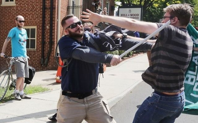 White nationalists clash with counter-protesters in the street after the "Unite the Right" rally was delcared a unlawful gathering by Virginia State Police August 12, 2017 in Charlottesville, Virginia. (Chip Somodevilla/Getty Images/AFP) White nationalists clash with counter-protesters in the street after the "Unite the Right" rally was delcared a unlawful gathering by Virginia State Police August 12, 2017 in Charlottesville, Virginia. (Chip Somodevilla/Getty Images/AFP)