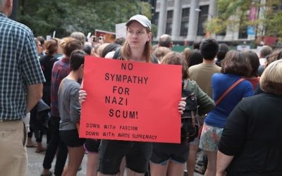 Illustrative: People gather downtown protest the alt-right movement and to mourn the victims of yesterdays rally in Charlottesville, Virginia on August 13, 2017 in Chicago, Illinois. (Scott Olson/Getty Images/AFP)