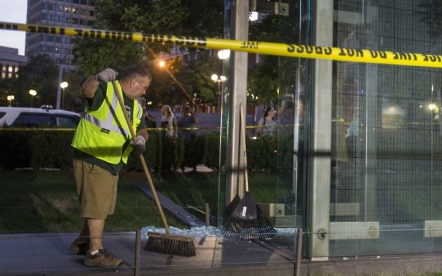 A worker cleans up broken glass at the New England Holocaust Memorial that was vandalized when a rock was thrown through a panel that was part of it on August 14, 2017 in Boston, Massachusetts. ( Scott Eisen/Getty Images/AFP) A worker cleans up broken glass at the New England Holocaust Memorial that was vandalized when a rock was thrown through a panel that was part of it on August 14, 2017 in Boston, Massachusetts. ( Scott Eisen/Getty Images/AFP)